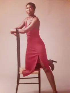 Arlinda modeling on a chair