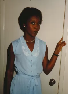 Arlinda standing in a doorway